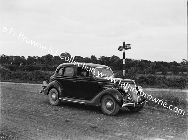 BROTHER JOE KEARNEY S.J. WITH FORD V8 NEAR CANAL BRIDGE EMO